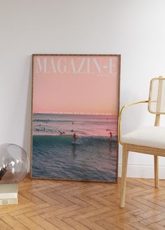 a magazine cover sitting on top of a hard wood floor next to a white chair