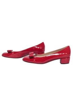 Add a pop of color to your footwear with these ravishing red patent leather "Vara" bow pumps by Ferragamo. Perfect for the office, these basic pumps feature a low block heel and rounded toe, with a playful bow front. Slip these on for a subtle touch of quirkiness in your professional attire! Size 7 Made in Italy Patent Leather Leather lining and sole Bow front with logo Block heel Rounded toe Heel height 1.5" Casual Red Patent Leather Heels, Red Patent Leather Business Shoes, Red Patent Leather Heels With Round Toe, Red Patent Leather Heels With Buckle Closure, Red Patent Leather Slingback Pumps With 4-inch Heel, Ferragamo Shoes, Bow Pumps, Low Block Heels, Professional Attire