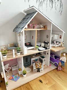 a doll house with furniture and accessories in it