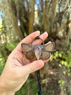 This necklace is made with real butterfly wings , and accented with labradorite stone. Both the wings and the stone appear as a silvery grey shimmers of purples and pinks depending at the angle Real Butterfly Wings, Real Butterfly, Doll Jewelry, Labradorite Necklace, Labradorite Necklaces, The Wings, Labradorite Stone, Butterfly Wings, Doll Toys