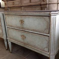 an antique dresser with two drawers and one drawer on the bottom, is shown in this image