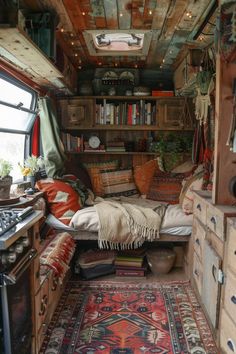 the inside of an rv with lots of furniture and rugs on the floor in front of it