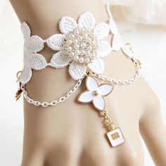 Include: Bracelet Product Code: LIN01235 Color: White Gender: Female Materials: White Lace,Golden Alloy Accessories,Artificial Pearls,Rhinestones Notice: Other Accessories Are Not Included Length: 18cm Width: 3.5cm Style Types: Gothic Womens Trend: Fashion Wrist Flower Lace Pearl Tassel Bridesmaid Bride Bracelet Wedding Dress Accessories Prom Jewelry.The Width Of The Lace Is About 3.5CM, The Front Decorative Part Of The Normal Size Is About 18CM (Including The 2 Metal Pieces That Clamp The Lace), And The Back Is The Button And The Adjusting Chain. The Tightness Can Be Adjusted To 19CM, And The Loose Can Be Adjusted To 24CM. Hand-Made, There Is An Error Within 2CM. Bride Bracelet, Wrist Flowers, Prom Accessories, Lace Bracelet, Lace Necklace, Tassel Bracelet, China Jewelry, Wedding Dress Accessories, Flower Lace