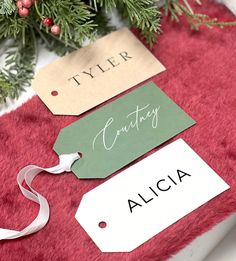 christmas presents wrapped in red and green with name tags