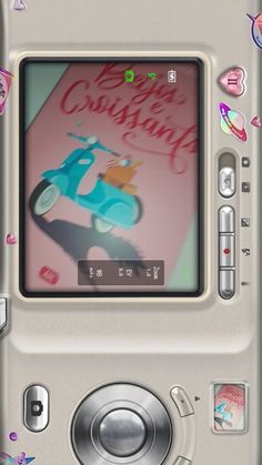 an old cell phone with a cartoon character on it's screen and some stickers around the back