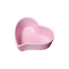 a pink heart shaped bowl on a white background