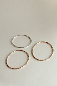 The Georgia is a timeless, minimalist bracelet style with an organic oval shape designed for constant wear. It is comfortable enough to wear even while sleeping, yet strong enough to gracefully withstand years of daily use. Each hand-soldered bracelet is shaped to mimic the contours of your forearm. Available in durable 14k gold fill, solid sterling silver, and solid 14k gold. These materials are water resistant and low maintenance. For more information, visit our Metals Encyclopedia. ✦ SIZING ( Soldered Bracelet, Oval Bangle, Ribbon Ring, Simple Organic, Bracelet Style, Minimalist Bracelet, Organic Shapes, Shape Design, Low Maintenance