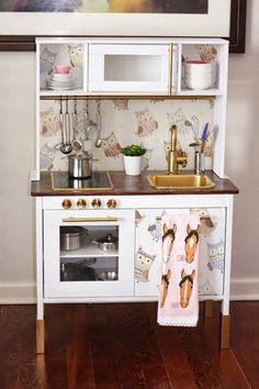 the kitchen is decorated with pink flamingos