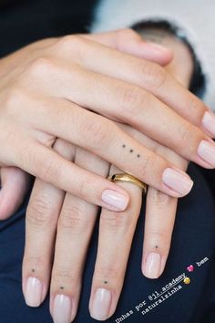 two people with wedding rings on their fingers