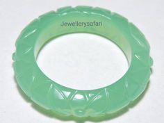 Buyer Will Receive 1 Piece Natural Chrysoprase Chalcedony Carved Band / Chalcedony Made Carved Band. you will really love it.you will gift it to your loved ones and friends. Product Details Product Name - Natural Chrysoprase  Chalcedony Carved Band  Gemstone - Chalcedony  Quantity - 1 Piece 100% Natural Gemstone ----------------------------------------------------------------------------- THIS BEAUTIFUL ITEM IS AVAILABLE ONLY ON ETSY ------------------------------------------------------------------------------------ Note - Kindly choose your required ring size from the  variation drop down menu. ------------------------------------------------------------------------------------ Please feel free to ask for any question.we will be happy to assist you Luxury Handmade Chrysoprase Ring, Carved Ring, Rock Crystal, Ring Band, Quartz Crystal, Beautiful Rings, Band Rings, Natural Gemstones, Free Gifts