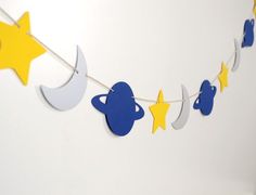 a garland with stars and planets hanging from it