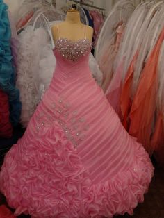 a pink dress on display in a store