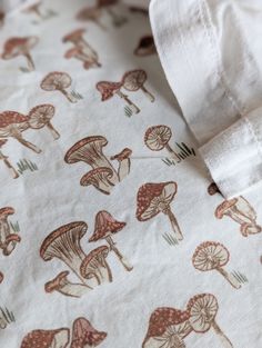 the mushroom print is on this white shirt