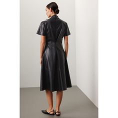 Black faux leather (100% Polyurethane) Midi dress. V-Neckline. Short Sleeves. Back zipper closure. 40" shoulder to hemline. Imported. Fitted A-line Leather Dress, Leather Midi Dress For Work, Black Leather Office Dress, Black Leather Dresses For Office, Sleek Leather Midi Dress, Chic Leather Midi Dress For Workwear, Chic Leather Midi Dress For Night Out, Chic Midi Dress With Back Zipper For Office, Elegant Leather Midi Dress For Fall