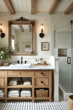 a bathroom with a sink, mirror and shower in it's centerpieces