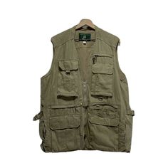 an olive green vest with multiple pockets