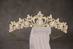 "Gold Rhinestone Wedding Tiara, Royal Bridal Crown, Gold Princess Crown, Princess Tiara, Gold Bridal Tiara, Gold Tiara, Gold Crown This elegant and sparkly Rhinestone Tiaras is perfect for your wedding or formal night out. This tiara is flexible. It will be perfect for the bride.  The Metal Headband measured approx. 13.5\" long. The rhinestone part of the headband is about 7.25\" long and the center is 1.5\" high. Tone color: Silver tone , Gold tone and Rose gold tone  To see more headbands or T Wedding Tiara Gold, Quince Tiaras Gold, Quince Crowns Gold, Gold Tiara Wedding, Wedding Hair Tiara, Gold Bridal Tiara, Golden Tiara, Tiara Royal, Princess Tiaras