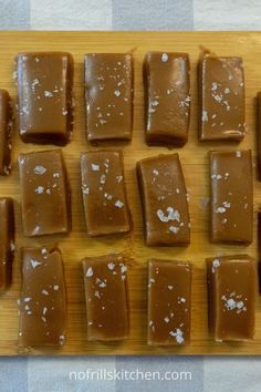 there are many pieces of chocolate on the cutting board