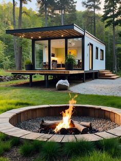 a small house with a fire pit in the yard