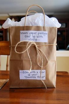 a brown paper bag sitting on top of a wooden table