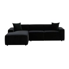 a black couch with pillows on top of it