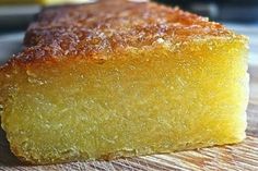 a piece of cake sitting on top of a wooden cutting board