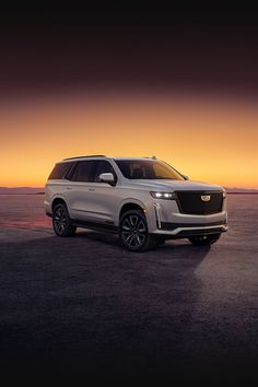 the new cadillac suv is shown at sunset