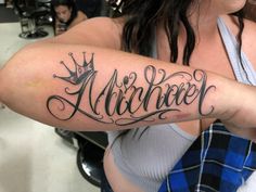 a woman with a tattoo on her arm that reads,'albrozer '