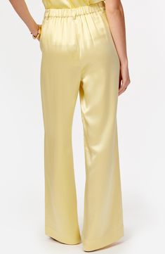 Enrich your ensembles with these luxuriously soft and silky wide-leg pants with flowy pleats. Zip fly with button-tab closure Back elastic waist Front slant pockets 73% acetate, 27% polyester Dry clean Imported Silk Wide Leg Pants With Elastic Waistband For Work, Silk Wide Leg Pants With Elastic Waistband, Wide Leg Silk Pants With Elastic Waistband, Elegant Silk Wide Leg Lounge Pants, Elegant Silk Bottoms For Loungewear, Silk Wide-leg Pants With Elastic Waistband, Elegant Silk Loungewear Bottoms, Solid Silk Wide-leg Pants, Elegant Silk Wide Leg Pants With Elastic Waistband