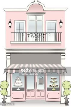 a pink building with a cake shop on the front