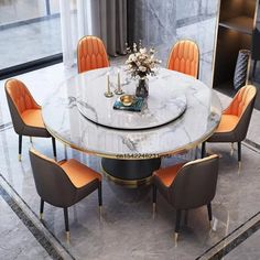 a marble dining table with orange chairs around it