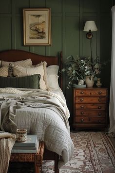 a bed sitting next to a window in a room with green paint on the walls