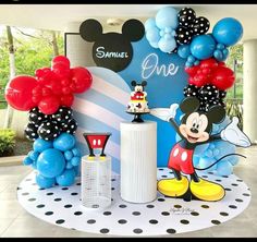 mickey mouse birthday party with balloons and decorations