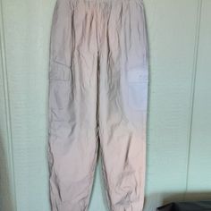 Forever 21 Women's Twill Cargo Joggers Size S,Silver, Lined Windbreaker Pants Nwt, Featuring An Elasticized Drawstring Waist, Side And Front Flap Pockets, Cuffed Hem And Baggy Fit, 100%Polyester. Made In China. 497. Forever 21 High Waist Bottoms With Pockets, Forever 21 High-waisted Bottoms With Pockets, Forever 21 Sporty Bottoms For Spring, Sporty Spring Bottoms From Forever 21, Forever 21 Cargo Pants With Pockets For Spring, Casual Forever 21 Bottoms With Cargo Pockets, Forever 21 Trousers With Pockets, Forever 21 Casual Bottoms With Elastic Waistband, Forever 21 Casual Cargo Pants For Spring