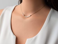 "Pearl Dainty Necklace, Gold Pearl Necklace, 14K Gold Filled Necklace, Pearl Gold Necklace, Layering Gold Necklace, Minimalist Gold Necklace. Dainty 14k Gold filled necklace and Pearl Beads. This simple yet elegant necklace looks great for layering with other delicate necklace or minimalist wear. simple and elegant necklace suitable for every day or evening. *Pearl Dainty Necklace *Pearl Gold necklace *14K Gold Filled Necklace *Pearl Necklace *Gold Delicate Necklace *Layering Necklace *Pearl Bea Minimalist Single Strand Necklace For Anniversary, Minimalist Single Strand Jewelry As A Gift, Necklace Layering Gold, Minimalist Gold Necklace, Dainty Necklace Gold, Pearl Gold Necklace, Minimalist Necklace Gold, Gold Filled Necklace, Necklace Layering