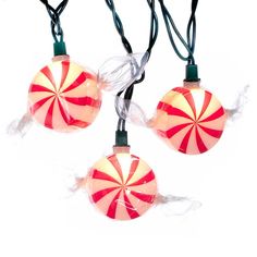 three red and white candy cane lights hanging from string