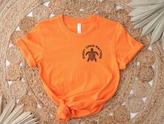 Support Indigenous awareness with our Every Child Matters shirt, designed to honor Orange Shirt Day 2024 and promote Truth and Reconciliation. A portion of every purchase of tgis September 30th Tshirt goes directly to Indigenous First Nations causes, making this tee not just a statement, but a contribution.   Please review all photos for respective size charts. How to Order: 1. Review all photos. 2. Choose your size from the drop-down menu. 3.Add to cart and repeat for additional items. PROCESSI Casual Cotton Shirt For Awareness Events, Casual Crew Neck Shirt For Awareness Events, Cotton Graphic Print Shirt For Awareness Events, Graphic Print Crew Neck Top For Awareness Events, Crew Neck Top With Graphic Print For Awareness Events, Cotton Shirt With Graphic Print For Awareness Events, Truth And Reconciliation, Orange Shirt Day, Every Child Matters