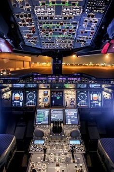 the cockpit of an airplane with multiple controls and lights on it's sides, including two