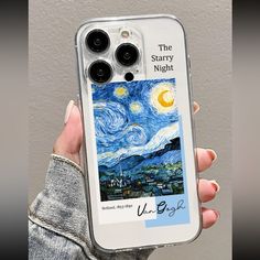 the starry night phone case is shown in someone's hand, holding it up