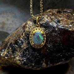 A Beautiful Colored Pompous Opal To Wear For Your Special Outgoings. Type - Dark Crystal Location - Lightning Ridge Weight - 0.25 Cts Size - 5mm X 4mm X 2mm Pattern - Striated Shape - Oval Brightness - B3 Metal - 18k Gold Filled Chain - 18” 1mm Box Chain You Can View A Full Clip At - Https://Www.Theopalsource.Com/Product-Page/Supercilious-Striated-Lightning-Ridge-Opal-Pendant-Necklace-18-1mm-Box-Chain Bullet Necklace, Dark Crystal, Art Deco Necklace, 18k Gold Jewelry, Copper Necklace, Mens Accessories Jewelry