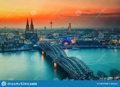 an aerial view of the cologne skyline at sunset