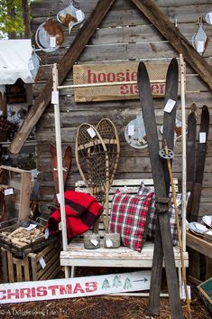 there is a bench made out of skis and snowboards