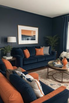 a living room with blue couches and orange pillows