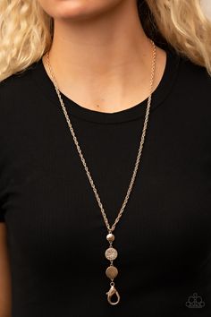 A white rhinestone encrusted gold frame is flanked between two gold discs scratched in a glistening shimmer as they drip from an ornately double-linked gold chain down the chest. A lobster clasp hangs from the bottom of the design to allow a name badge or other item to be attached. Features an adjustable clasp closure.

Sold as one individual lanyard. Includes one pair of matching earrings. Gold Lanyard, Lanyard Necklace, Gold Disc, Paparazzi Accessories, White Rhinestone, Necklace Online, Affordable Jewelry, Paparazzi Jewelry, Earrings Gold