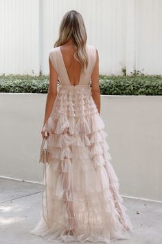 Forever More Dress - Lauren Nicole. Dreamiest statement piece yet! Blush nude tulle maxi dress shaped by a double plunging neckline. Nude bodysuit lining. Back zipper closure. 100% Polyester. #bridetobe #weddingguestdress #eventdress #blacktie #gala #graduationdress #birthdaydress #summerdress #springdress #trendy #model Layered Tull Dress, Tulle Dresses Bridesmaid, Champagne Tulle Bridesmaid Dresses, Cream Tulle Dress, Floral Tiered Dress, Neutral Prom Dress, Champagne Tulle Dress, 2 Piece Bridesmaid Dress, Blush Formal Dress