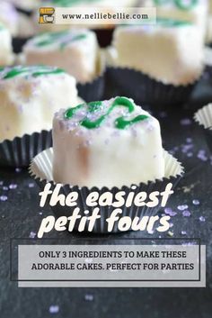 some white and green desserts on top of a black table with confetti