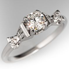 a diamond ring with three stones on it