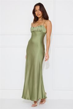 Length from bust to hem of size S: 120cm. Chest: 39cm, Waist: 32cm, across front only of size S. Maxi dress. Semi-lined. Model is a standard XS and is wearing size XS. True to size. Non-stretch. Satin. Twist detail to the back. Gathered top. Zipper with hook eye closure. Cold hand wash only. Polyester. Effortlessly chic in the Silk Shimmers Satin Maxi Dress. Featuring a captivating twist detail to the back and a delicately gathered top. Embrace timeless elegance with every step in this radiant dress that is sure to make you shine on any occasion. Khaki Dress Outfit Wedding, Green Classy Dress, Khaki Dress Outfit, Green Satin Maxi Dress, Light Green Dress, Gathered Top, Sage Dress, Olive Dress, Shimmer Dress