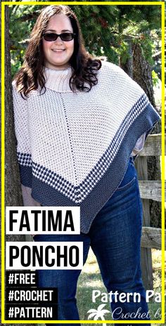 a woman is wearing a poncho and standing in front of a fence with her hands on her hips