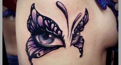 a close up of a woman's face with butterfly wings on her thigh and eyes